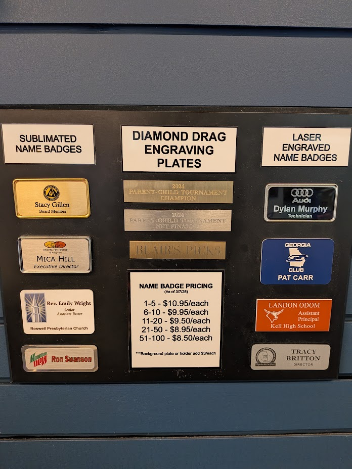 Display of sublimated and laser-engraved name badge options